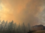 This photo provided by Spokane Fire District 9 shows the Upriver Fire burning northeast of Spokane, Wash., on Tuesday, June 16, 2026. (Robert Gray/Spokane Fire District 9 via AP)