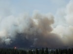 The Old Trails Fire is seen from the Centennial Trail near W. College Ave., in Spokane, Wash. (AP Photo/Young Kwak)