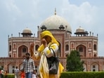 Visitors seen in humid weather in the afternoon at Humayun's tomb in New Delhi on Sunday, July 26, 2026. (Vipin Kumar/HT Photo)