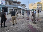 Police officers examine the site following a suicide bombing, in Kabal, a town in the Swat Valley in Pakistan's Khyber Pakhtunkhwa province