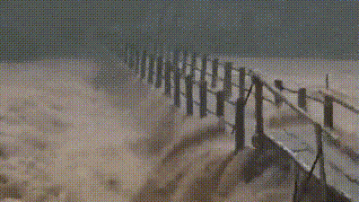 In one clip from Kerala, fast-flowing water can be seen rushing through a water body as a bridge was destroyed. (Credit: PTI/X) In one clip from Kerala, fast-flowing water can be seen rushing through a water body as a bridge was destroyed. (Credit: PTI/X)
