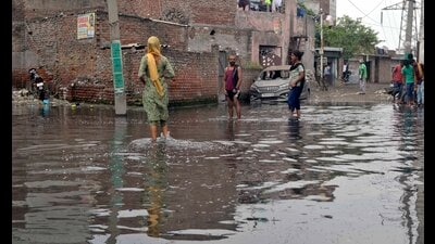 Overflowing sewage on the streets and road in bad condition in Tajour area in Ludhiana on Sunday. (Gurpreet Singh/HT) Overflowing sewage on the streets and road in bad condition in Tajour area in Ludhiana on Sunday. (Gurpreet Singh/HT)