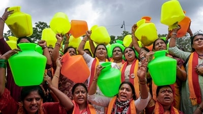 Members of Karnataka Rakshana Vedike (KRV) women's wing holding empty pots raise slogans and stage a protest against the Cauvery Water Regulation Committee (CWRC) in Bengaluru, Saturday, Aug. 1, 2026. 
