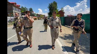 Police personnel keep vigil along the Jammu-Srinagar National Highway following a terrorist attack, in Kulgam district, Jammu and Kashmir, on Sunday. (PTI) Police personnel keep vigil along the Jammu-Srinagar National Highway following a terrorist attack, in Kulgam district, Jammu and Kashmir, on Sunday. (PTI)
