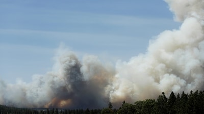 The Old Trails Fire is seen from the Centennial Trail near W. College Ave., in Spokane, Wash. (AP Photo/Young Kwak) (AP Photo/Young Kwak) The Old Trails Fire is seen from the Centennial Trail near W. College Ave., in Spokane, Wash. (AP Photo/Young Kwak) (AP Photo/Young Kwak)