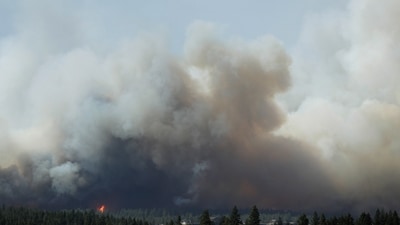 The Old Trails Fire is seen from the Centennial Trail near W. College Ave., in Spokane, Wash. (AP Photo/Young Kwak) (AP Photo/Young Kwak) The Old Trails Fire is seen from the Centennial Trail near W. College Ave., in Spokane, Wash. (AP Photo/Young Kwak) (AP Photo/Young Kwak)