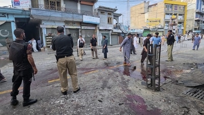 Police officers examine the site following a suicide bombing, in Kabal, a town in the Swat Valley in Pakistan's Khyber Pakhtunkhwa province (AP) Police officers examine the site following a suicide bombing, in Kabal, a town in the Swat Valley in Pakistan's Khyber Pakhtunkhwa province (AP)