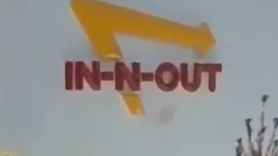 This still image captured from video by a witness shows the scene of a shooting that started at an In-N-Out Burger restaurant, Saturday, Aug. 1, 2026 in Twin Falls, Idaho. (Kevin Bell Jr. via AP)
