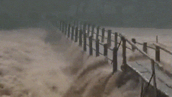 In one clip from Kerala, fast-flowing water can be seen rushing through a water body as a bridge was destroyed.