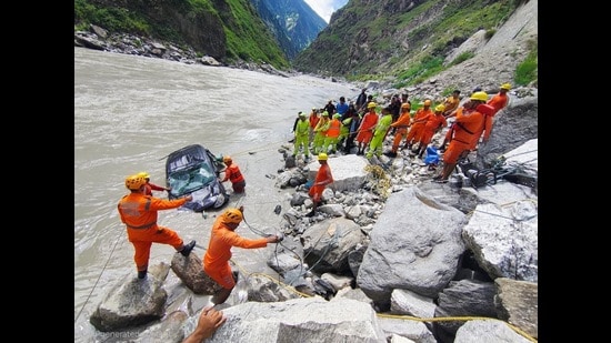 Officials said that with the assistance of the National Disaster Response Force (NDRF), the fire services team and local police, the vehicle was retrieved from the river. The bodies were found inside the vehicle. (HT Photo)