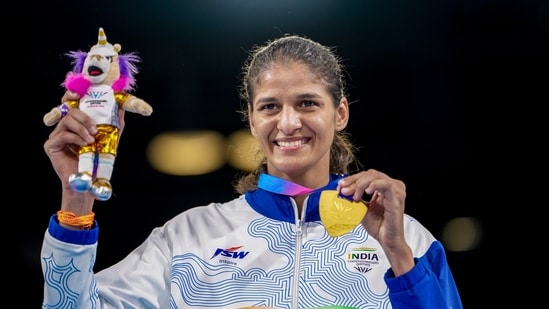 India's Jaismine Lamboria clinches a gold medal after winning against Northern Ireland's Michaela Walsh during the Women's 57kg boxing final

