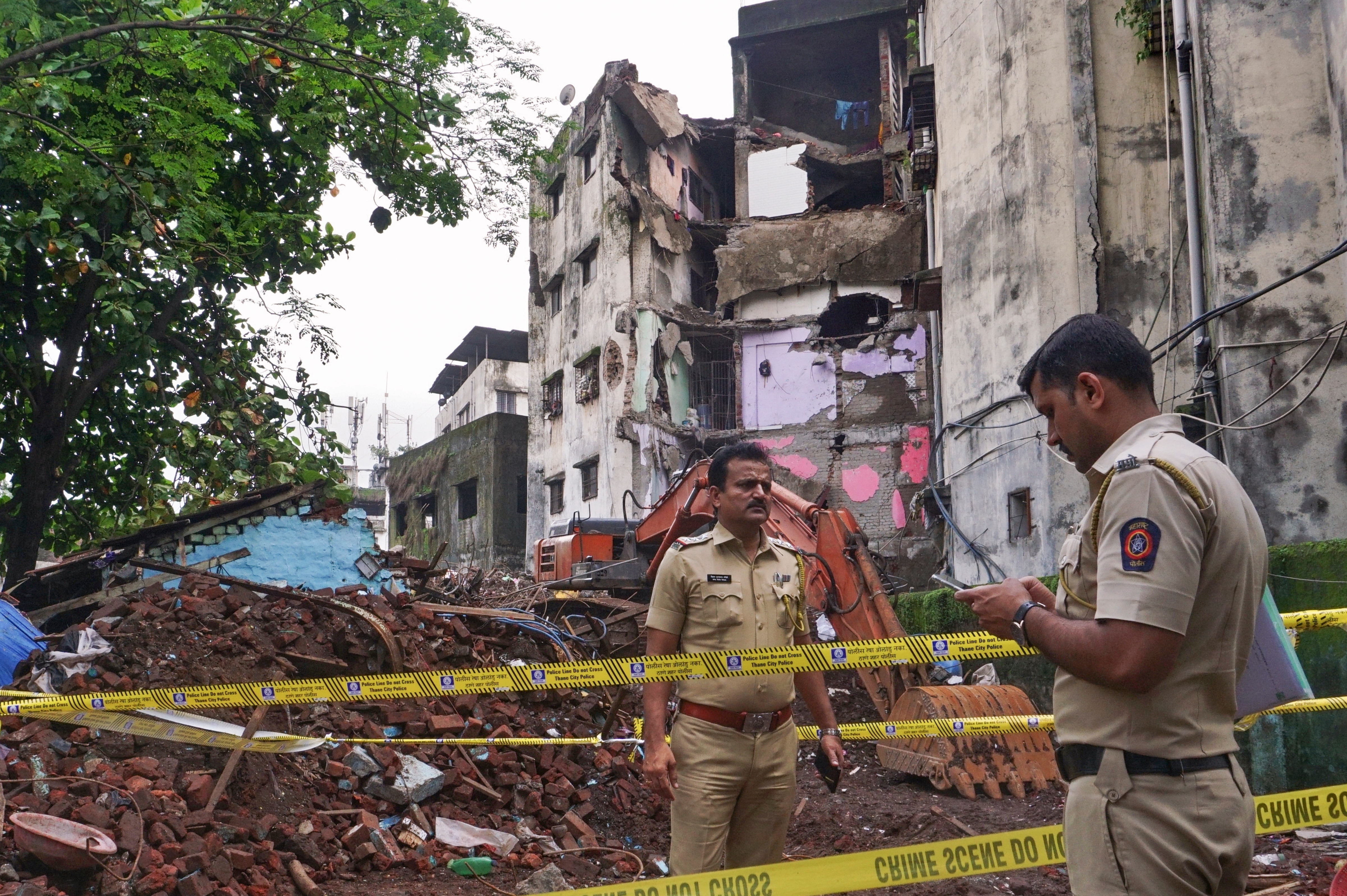 Police personnel conduct an investigation at the site where a four-storey building collapsed, at Bhiwandi. (File Photo/PTI) Police personnel conduct an investigation at the site where a four-storey building collapsed, at Bhiwandi. (File Photo/PTI)
