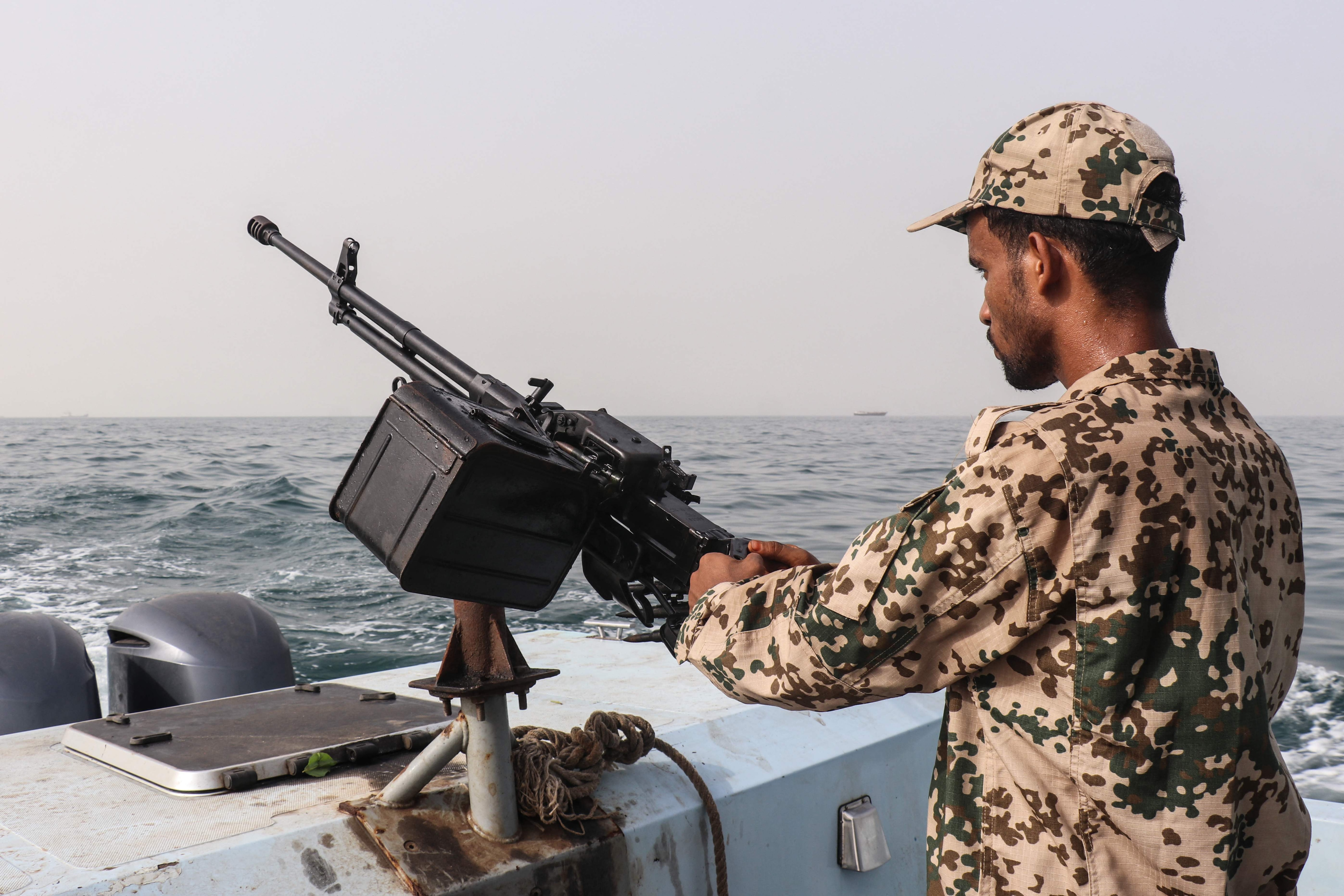A sailor from the navy of Yemen's Aden-based internationally recognised government stands at a machine-gun position aboard a vessel patrolling a shipping lane off Hanish Island in the Red Sea. (AFP) A sailor from the navy of Yemen's Aden-based internationally recognised government stands at a machine-gun position aboard a vessel patrolling a shipping lane off Hanish Island in the Red Sea. (AFP)