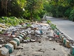 A cycle track lies damaged, obstructed and strewn with garbage in Gomti Nagar Extension, Lucknow. (Deepak Gupta/HT)
