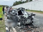 A view of the damaged car after it crashed into a stationary lorry near the Nallampalli Junction on the Pollachi–Palani National Highway,