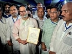 Jan Suraaj Party candidate Prashant Kishor poses for a picture with his winning certificate following his victory from the Bankipur assembly seat in Patna on Monday. (Photo: X/@jansuraajonline)