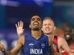 Gulveer Singh crosses the finish line to win the silver medal in the men's 10,000 meters at the Commonwealth Games in Glasgow. (AP Photo)