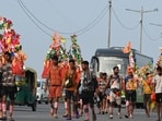 Kanwariyas, devotees of the God Shiva, carry holy water of the river Ganges during the 'Kanwar Yatra' pilgrimage in the sacred month of Sawan in New Delhi, India, on Sunday, August 2, 2026.