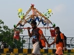 Kanwariyas, devotees of the God  Shiva, carry holy water of the river Ganges during the 'Kanwar Yatra' pilgrimage in the sacred month of Sawan