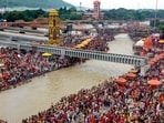 'Kanwariyas' and others take a holy dip in the Ganga river during the annual 'Kanwar Yatra', at Har Ki Pauri, in Haridwar, Uttarakhand.