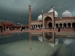 Gram it: Visitors at the Jama Masjid photographed amid heavy rainfall in Delhi. IMD has a forecast of more rains in the week ahead. 
