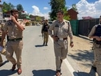 Police personnel keep vigil along the Jammu-Srinagar National Highway following a terrorist attack, in Kulgam district, Jammu and Kashmir, on Sunday.(HT_PRINT)