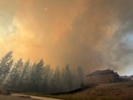 This photo provided by Spokane Fire District 9 shows the Upriver Fire burning northeast of Spokane, Wash., on Tuesday, June 16, 2026. (Robert Gray/Spokane Fire District 9 via AP)