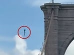 After jumping from the Brooklyn Bridge, Galymzhan Abaildayev, 44, was rescued by the Harbor Unit. (X/@m_alejandr07)