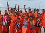 Women devotees at Dashashwamedh Ghat collecting sacred Ganga water in Prayagraj (HT)