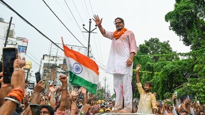 Jan Suraaj Party (JSP) founder Prashant Kishor waves at party workers during a victory march as he takes the lead in the Bankipur assembly bypoll result, in Patna on Monday. (ANI)