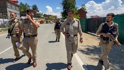 Police personnel keep vigil along the Jammu-Srinagar National Highway following a terrorist attack, in Kulgam district, Jammu and Kashmir, on Sunday. (HT_PRINT) Police personnel keep vigil along the Jammu-Srinagar National Highway following a terrorist attack, in Kulgam district, Jammu and Kashmir, on Sunday. (HT_PRINT)