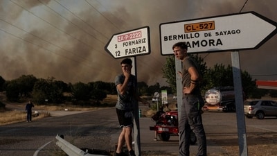 Locals watch the fire near Formariz during a wildfire in Zamora province, Spain Locals watch the fire near Formariz during a wildfire in Zamora province, Spain