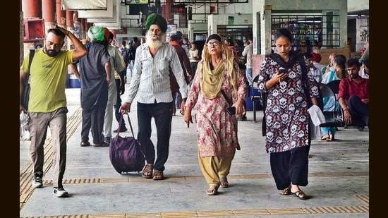 Commuters at the ISBT in Ludhiana on Monday. (Gurpreet Singh/HT)