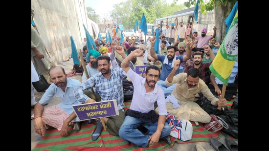 Contractual employees during a protest at the Bathinda bus depot on Monday. (HT photo)