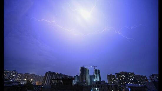Lightning illuminates the skyline in Lucknow on Monday. (Deepak Gupta/HT Photo)