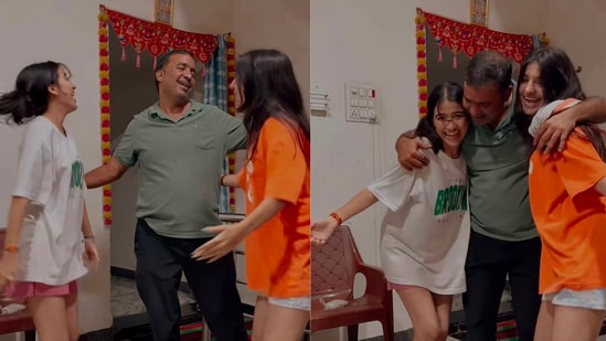 The father and his daughters share a joyful dance after reuniting.(Instagram/@__official_mahi_23)