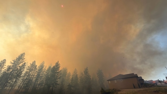 This photo provided by Spokane Fire District 9 shows the Upriver Fire burning northeast of Spokane, Wash., on Tuesday, June 16, 2026. (Robert Gray/Spokane Fire District 9 via AP)