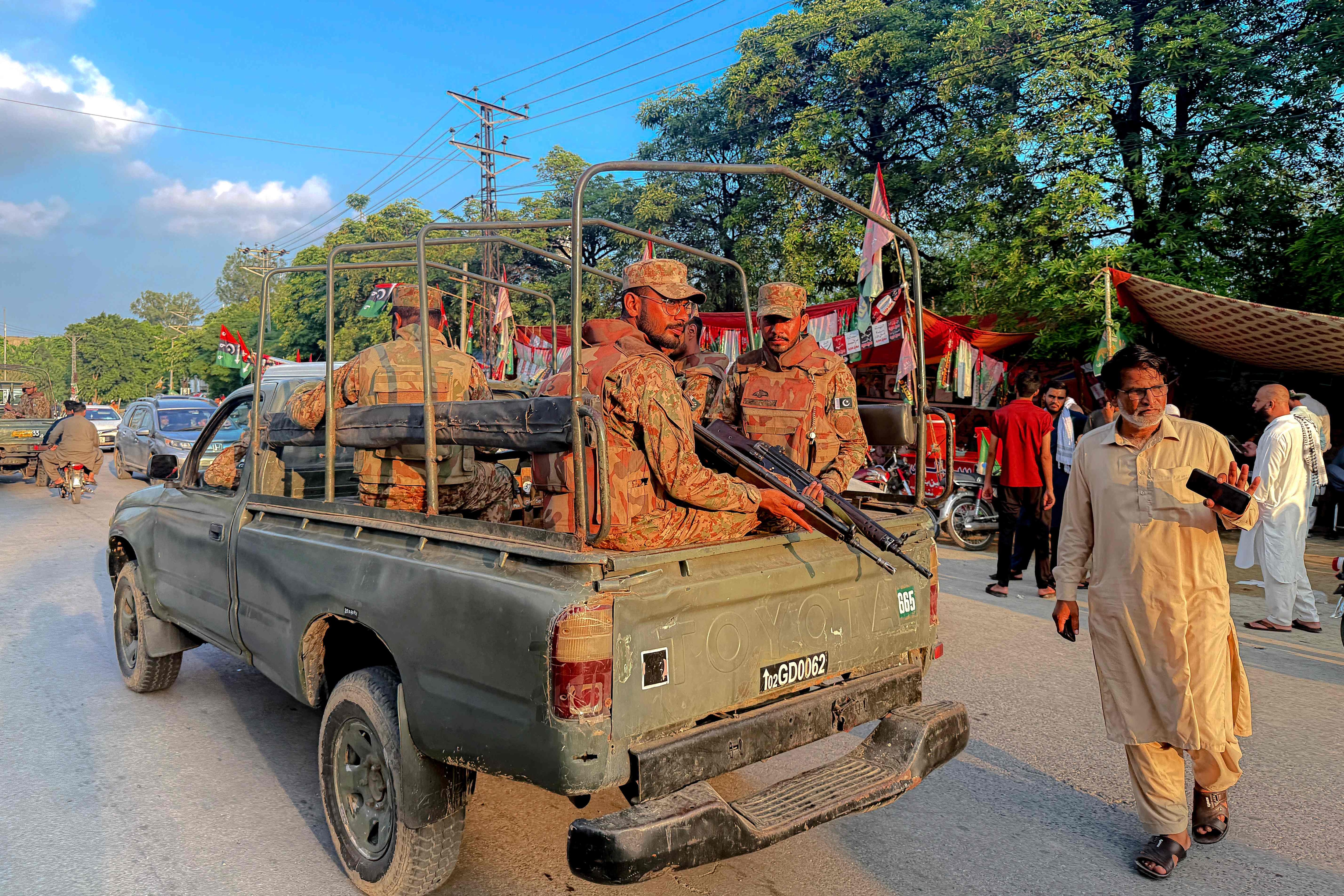 Army personnel patrol outside a polling station during the first phase of voting for the local legislature in Mirpur. (AFP) Army personnel patrol outside a polling station during the first phase of voting for the local legislature in Mirpur. (AFP)