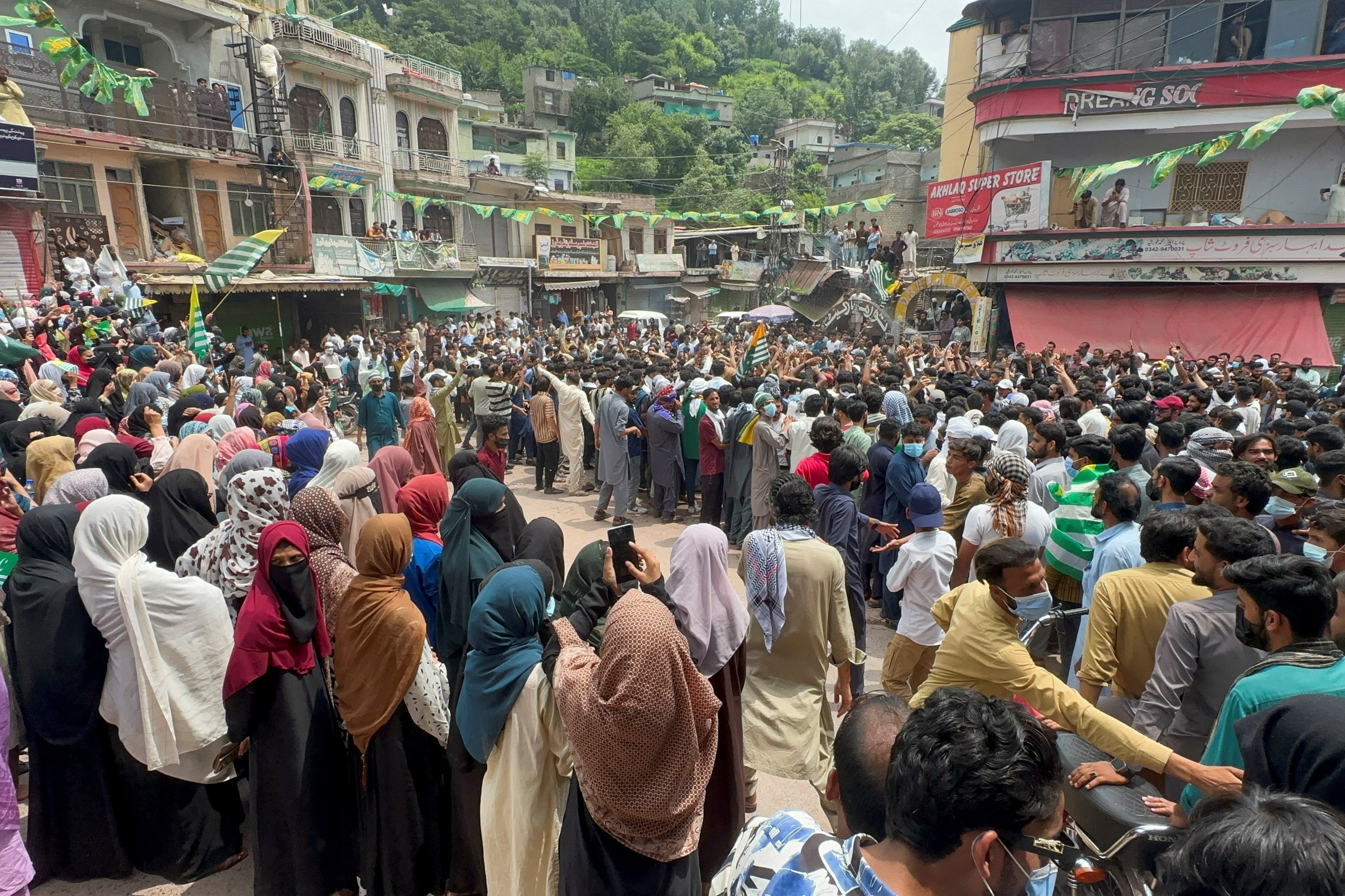 People gather in support of a protest by JAAC in Kotli on July 30. (REUTERS)