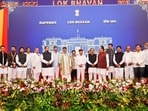 Karnataka Chief Minister DK Shivakumar in a group photograph with state Governor Thaawarchand Gehlot and newly inducted ministers during the Karnataka Cabinet expansion ceremony at Raj Bhavan in Bengaluru. 