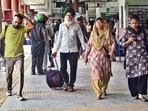 Commuters at the ISBT in Ludhiana on Monday. (Gurpreet Singh/HT)