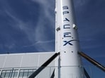 A SpaceX Falcon 9 rocket is displayed outside a Space Exploration Technologies Corp. facility in Hawthorne, California on March 26, 2026.(AFP)