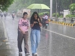 Gram it: As monsoon showers soak Delhi, giving the city a much-needed respite from heat and humidity, here's how some college students were spotted taking shade under umbrella while they walked back home from Delhi University's North Campus, on Tuesday. Delhiites, brace yourselves for more rain as the India Meteorological Department (IMD) has a forecast of light to moderate rainfall for today as well.
