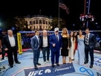 US President Donald Trump, first lady Melania Trump, UFC CEO Dana White and other guests pose inside the Octagon at UFC Freedom 250 on the South Lawn of the White House in Washington, DC.(REUTERS)