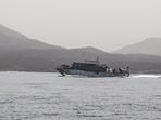 The vessel's 14-member crew were recused in a joint-operation.