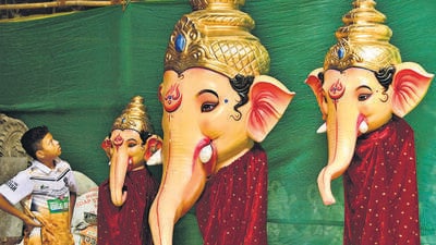 Mumbai, India – 28 June 2026: Children observe an Idol Lord Ganesh at a workshop at Lalbaug l, as begin for the upcoming Ganesh Festival, in Mumbai, India, on Sunday, 28 June 2026. (Photo by Bhushan Koyande/HT Photo) Mumbai, India – 28 June 2026: Children observe an Idol Lord Ganesh at a workshop at Lalbaug l, as begin for the upcoming Ganesh Festival, in Mumbai, India, on Sunday, 28 June 2026. (Photo by Bhushan Koyande/HT Photo)