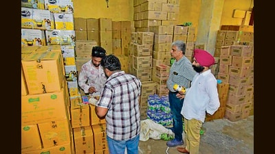 Officials of the food safety department during the raid in Deep Nagar, Ludhiana on Tuesday. (Gurpreet Singh/HT)