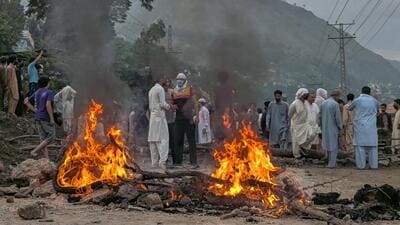 Supporters of an outlawed alliance of activist groups "Joint Awami Action Committee" (JAAC) block a road and set on fire woods after clashes with police during protest demanding greater political rights and the abolition of 12 legislative refugee seats, in Muzaffarabad, the capital of Pakistan-occupied Kashmir, on July 31 (AP File Photo/Ishfaq Hussain) Supporters of an outlawed alliance of activist groups "Joint Awami Action Committee" (JAAC) block a road and set on fire woods after clashes with police during protest demanding greater political rights and the abolition of 12 legislative refugee seats, in Muzaffarabad, the capital of Pakistan-occupied Kashmir, on July 31 (AP File Photo/Ishfaq Hussain)