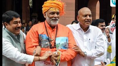 The Opposition MPs, including Pappu Yadav, in an unusual display of protest used street theatre to protest against the alleged embezzlement of donations. (ANI)