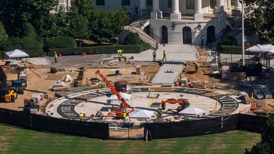 Construction continues on the White House helipad on the South Lawn, July 30, 2026, in Washington. (AP Photo/Manuel Balce Ceneta)
